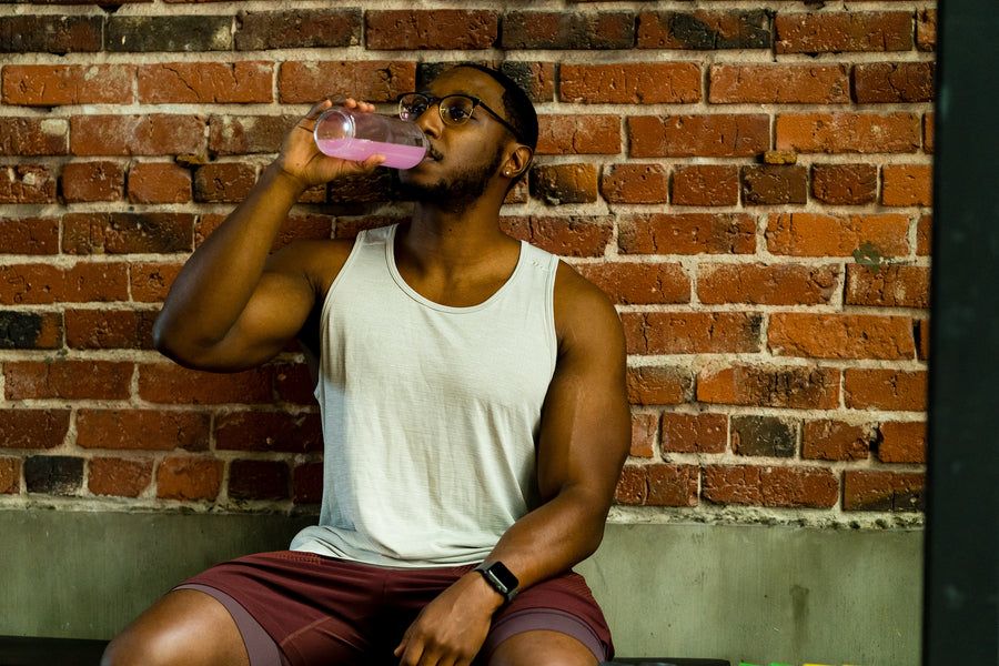 man drinking Nuun Sport during a workout