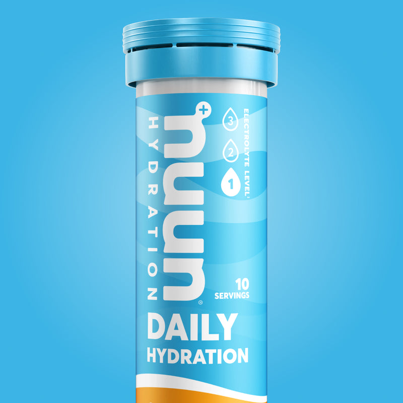 Tube of Nuun Daily on a light blue background.