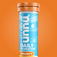 Tube of Nuun Immunity against an orange background.